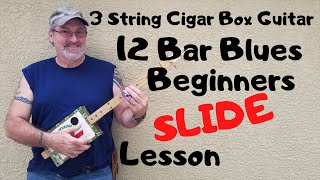 How to play a 3 string Cigar Box Guitar  Beginner slide lesson 12 Bar Blues [upl. by Etti]